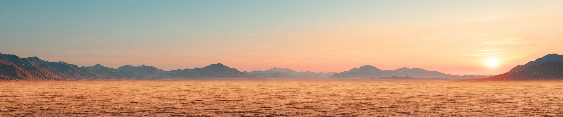 Stunning sunset over vast desert landscape with distant mountains
